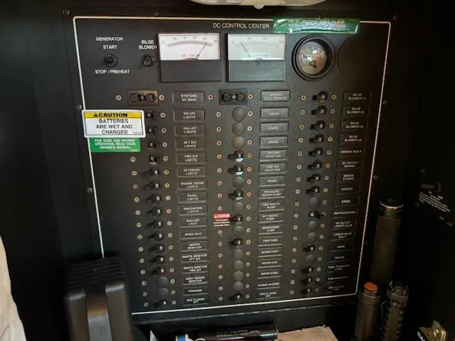 Slide: The Image of DC control panel of a 2003 Carver 410 Sport Sedan boat. - 48