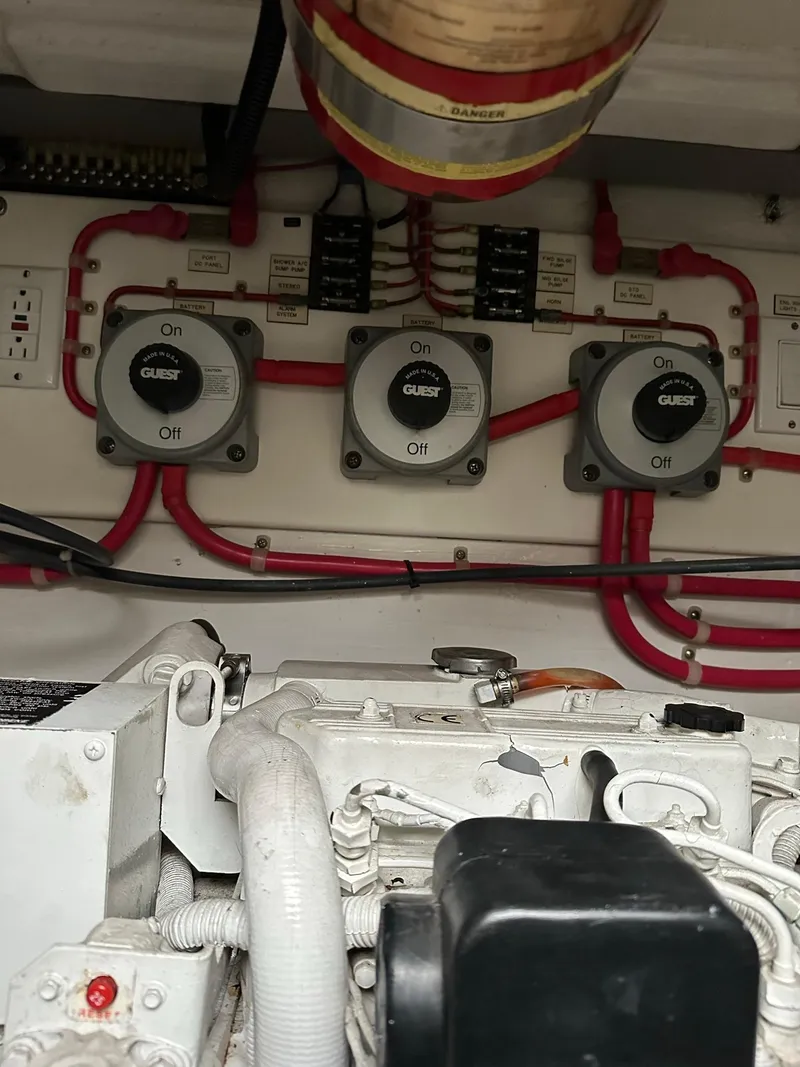 Slide: The Image of Engine room of 2000 Cabo 35 Express with electrical components and wiring. - 11