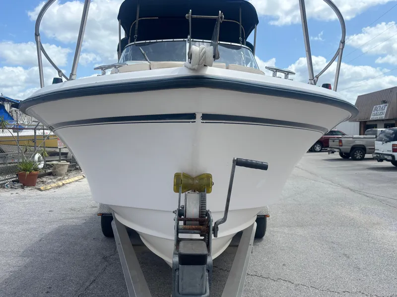 Slide: The Image of 2000 Grady-White 228 Seafarer boat on trailer, front view, under blue sky. - 10