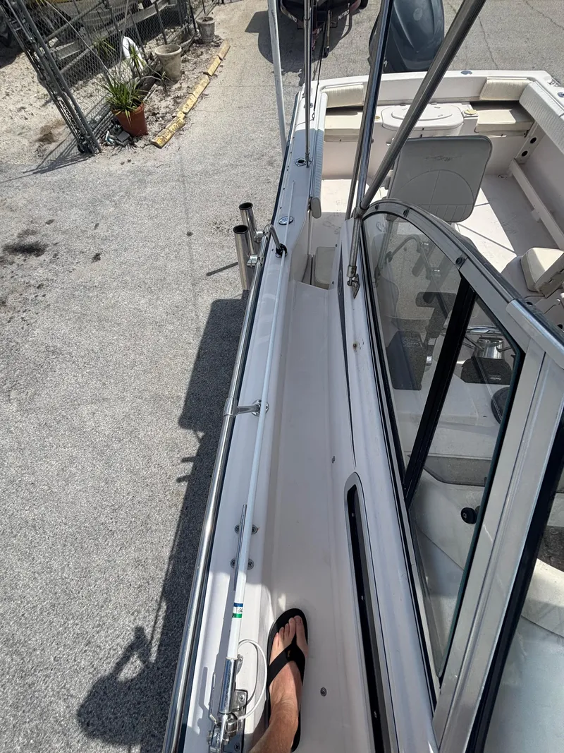 Slide: The Image of 2000 Grady-White 228 Seafarer boat deck view with open cockpit and seating. - 11