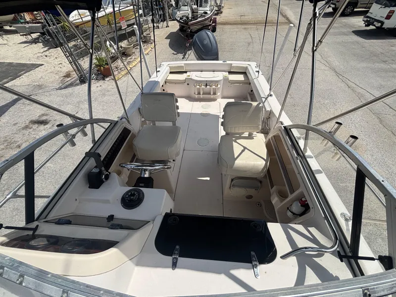 Slide: The Image of 2000 Grady-White 228 Seafarer boat interior with seating and steering console. - 18