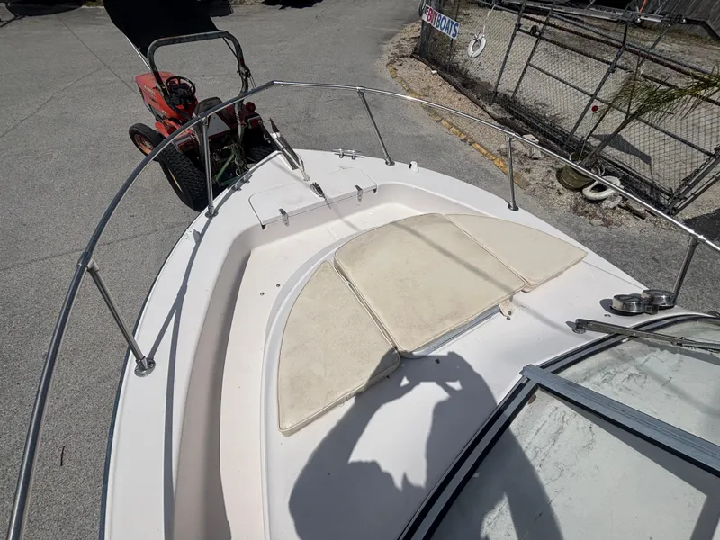 Slide: The Image of 2000 Grady-White 228 Seafarer boat deck with seating and railing. - 19