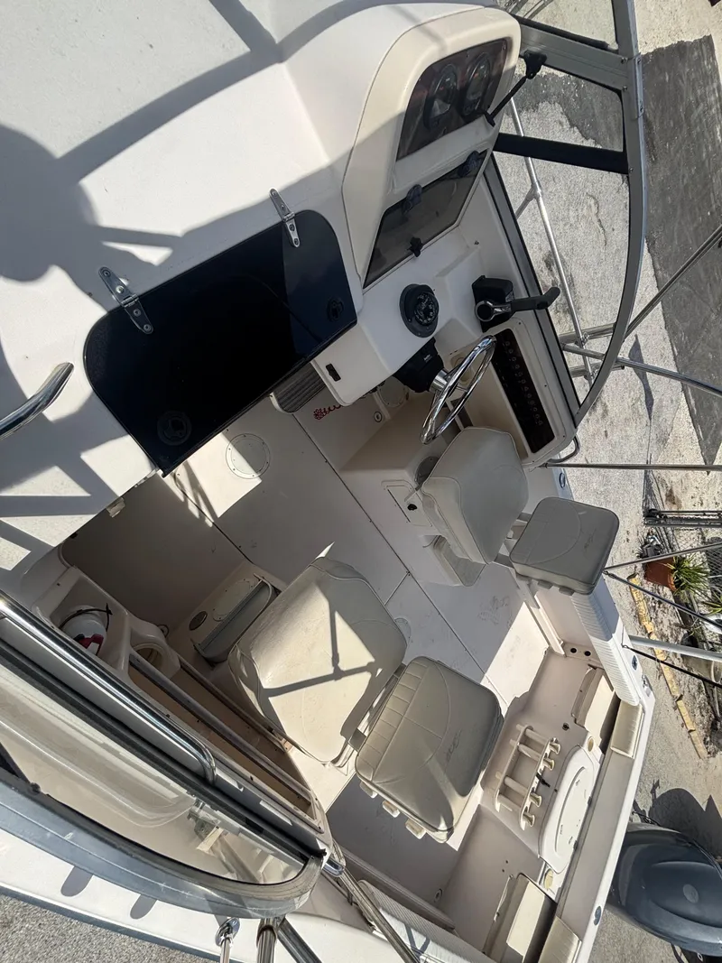 Slide: The Image of 2000 Grady-White 228 Seafarer boat interior with helm and seating area. - 20