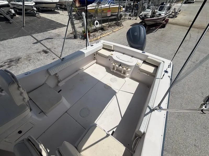 Slide: The Image of 2000 Grady-White 228 Seafarer boat interior, spacious deck, and seating area. - 21
