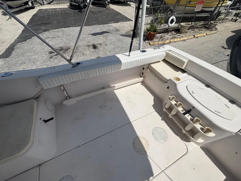 Slide: The Image of 2000 Grady-White 228 Seafarer boat interior with seating and storage compartments. - 23