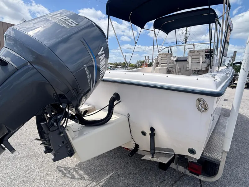 Slide: The Image of Grady-White 228 Seafarer 2000 boat with Yamaha 225 outboard motor, docked under blue sky. - 25