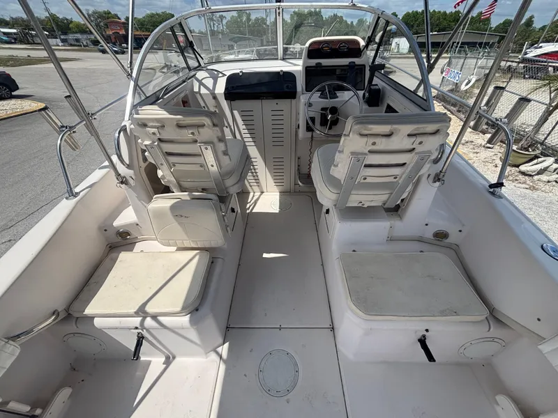 Slide: The Image of 2000 Grady-White 228 Seafarer boat interior with seating and steering console. - 26
