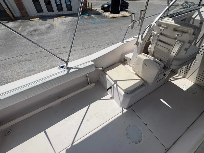 Slide: The Image of 2000 Grady-White 228 Seafarer boat interior with seating and steering area. - 27