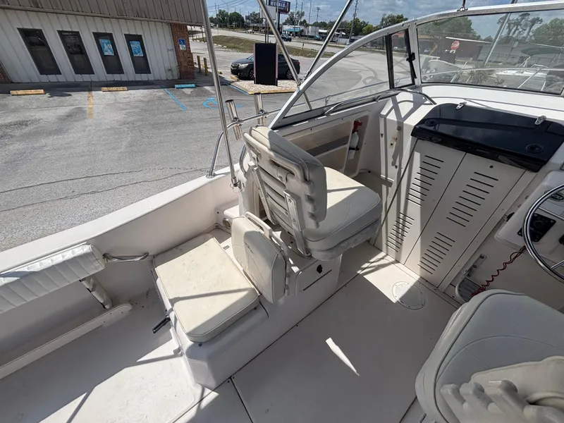 Slide: The Image of 2000 Grady-White 228 Seafarer boat interior with seating and steering console. - 30