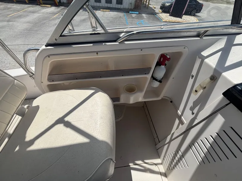 Slide: The Image of Interior of a 2000 Grady-White 228 Seafarer boat, featuring seating and safety equipment. - 37