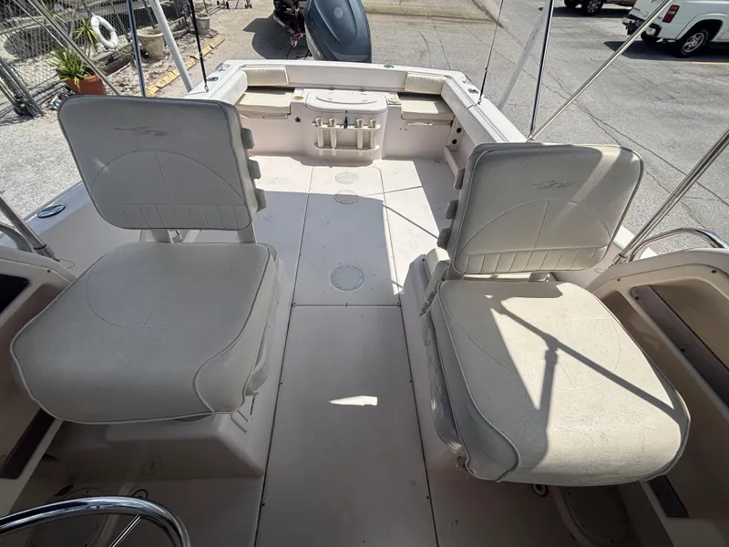 Slide: The Image of 2000 Grady-White 228 Seafarer boat interior with two cushioned seats and storage area. - 39