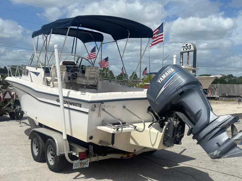 Slide: The Image of 2000 Grady-White 228 Seafarer boat with Yamaha outboard motor on trailer. - 4
