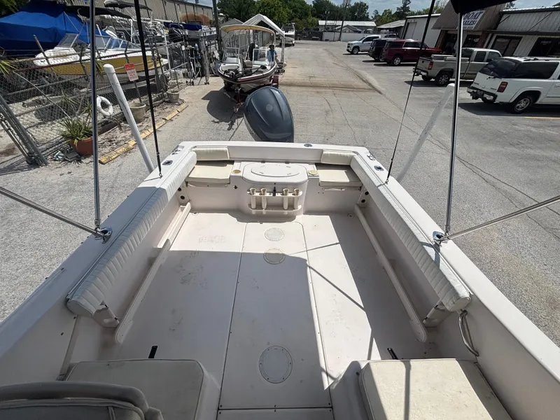 Slide: The Image of 2000 Grady-White 228 Seafarer boat interior, spacious deck, parked in a marina. - 40