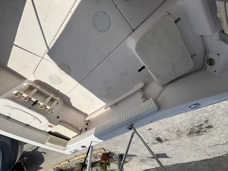 Slide: The Image of 2000 Grady-White 228 Seafarer boat interior, showing seating and storage compartments. - 41