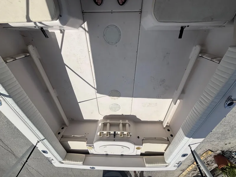 Slide: The Image of 2000 Grady-White 228 Seafarer boat interior, showing spacious deck and seating arrangement. - 42