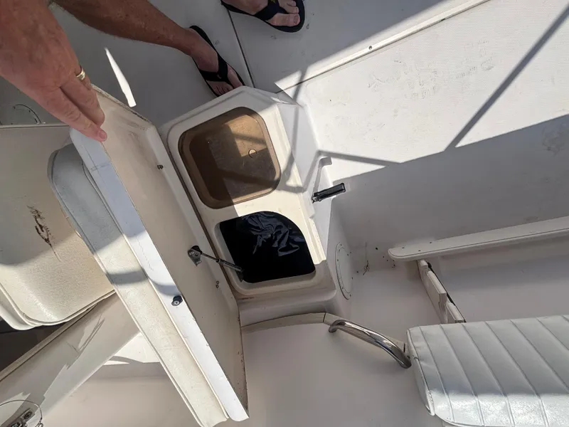 Slide: The Image of Open storage compartment on 2000 Grady-White 228 Seafarer boat deck. - 44