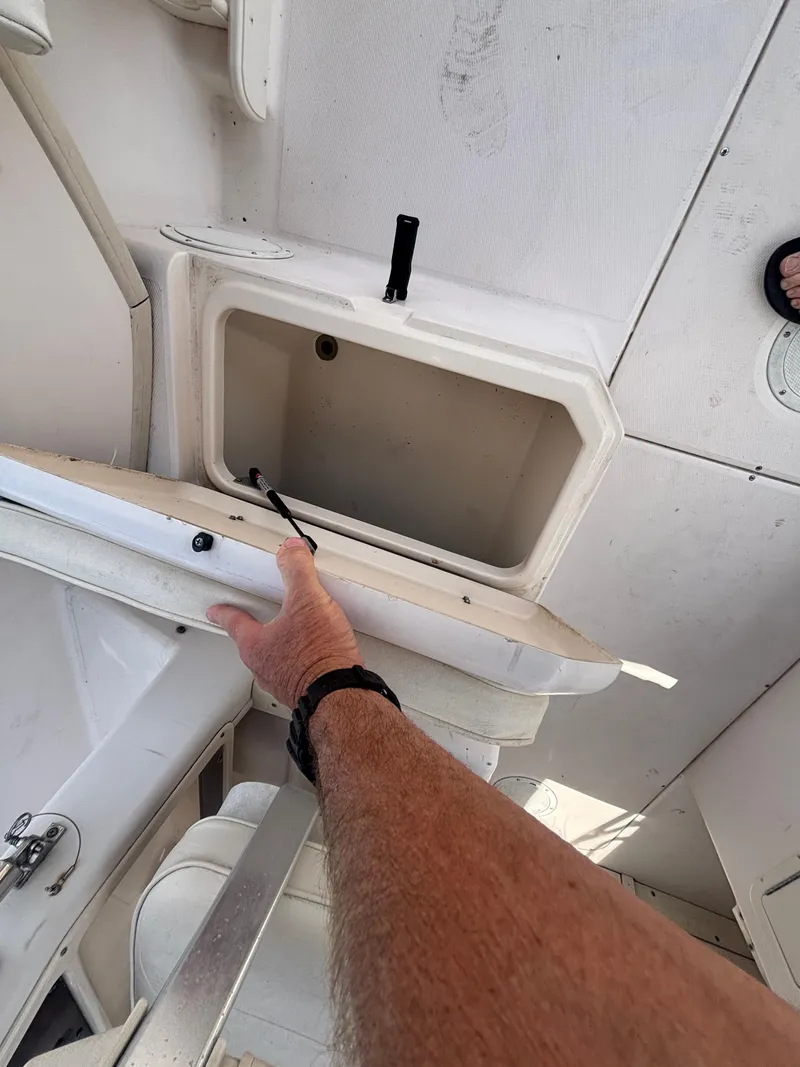 Slide: The Image of Open storage compartment on 2000 Grady-White 228 Seafarer boat deck. - 45