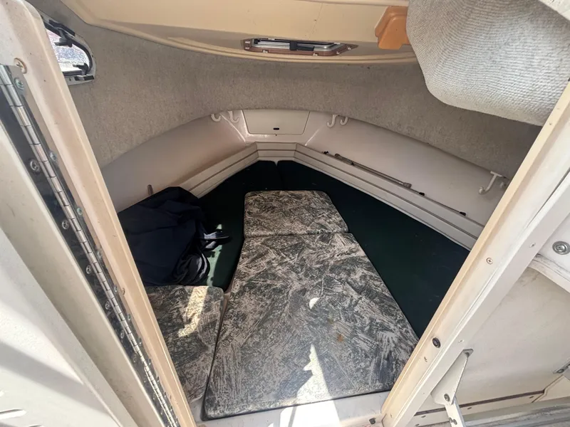 Slide: The Image of Cabin interior of 2000 Grady-White 228 Seafarer boat with cushioned seating. - 46