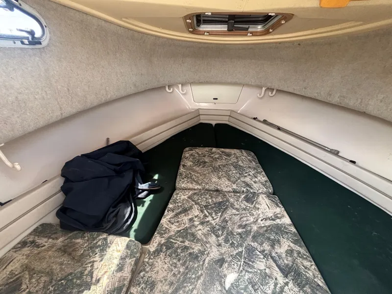 Slide: The Image of Interior cabin of 2000 Grady-White 228 SEAFARER boat with seating and storage. - 48