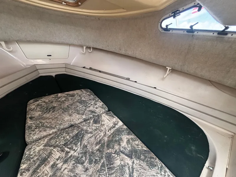 Slide: The Image of Interior cabin of 2000 Grady-White 228 Seafarer boat with cushioned seating. - 49