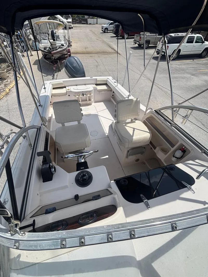 Slide: The Image of 2000 Grady-White 228 Seafarer boat interior with seating and steering wheel. - 7