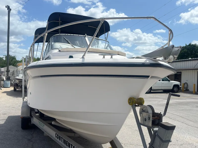 Slide: The Image of 2000 Grady-White 228 Seafarer boat on trailer under blue sky. - 9