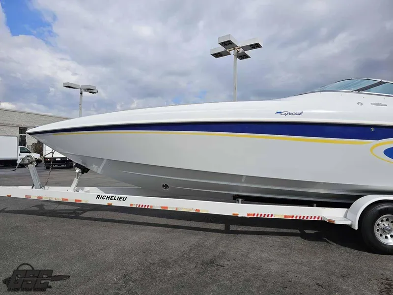 Slide: The Image of 2003 Baja .38 Special boat on trailer under cloudy sky. - 10