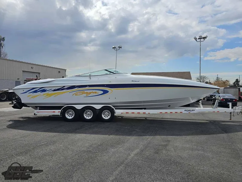 Slide: The Image of 2003 Baja .38 Special boat on trailer under cloudy sky. - 19