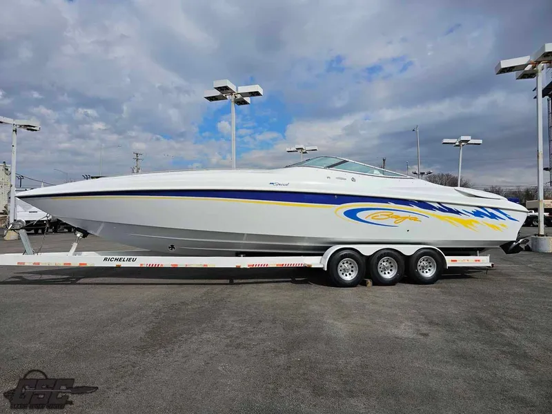 Slide: The Image of 2003 Baja .38 Special speedboat on a trailer, featuring sleek design and vibrant graphics. - 2