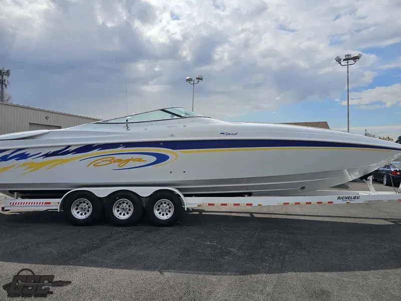 Slide: The Image of 2003 Baja .38 Special speedboat on a trailer under cloudy skies. - 20