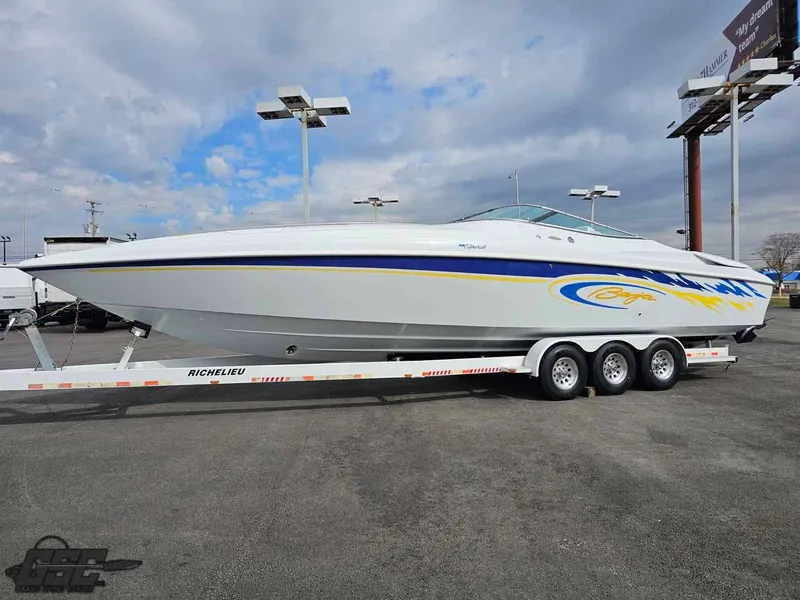 Slide: The Image of 2003 Baja .38 Special boat on a trailer, featuring sleek design and vibrant graphics. - 3