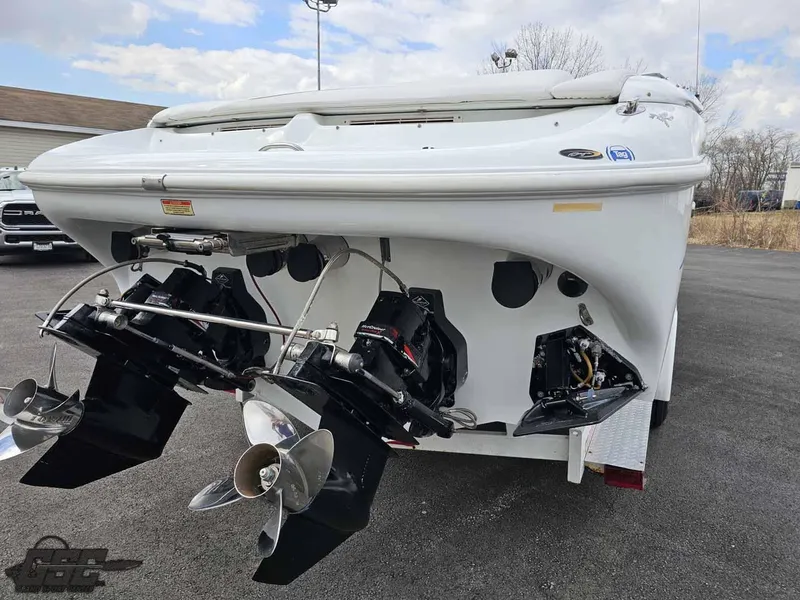 Slide: The Image of 2003 Baja .38 Special boat with dual propellers, parked on asphalt. - 31