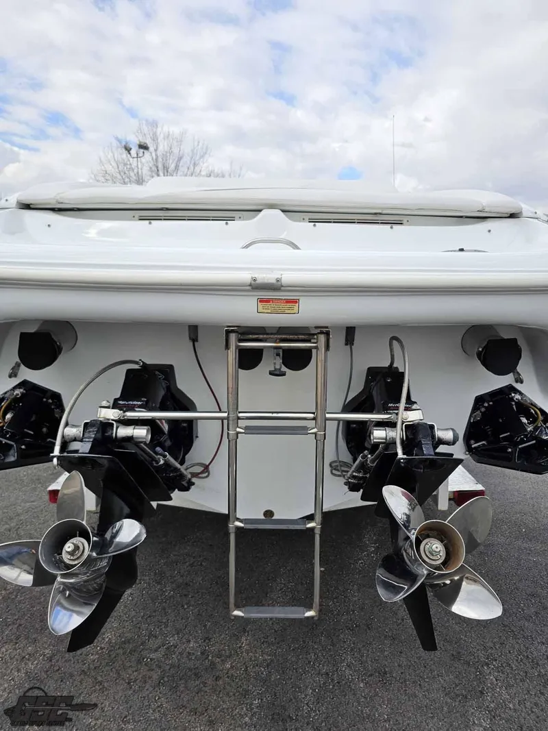 Slide: The Image of 2003 Baja .38 Special boat with dual propellers and ladder, viewed from the rear. - 35