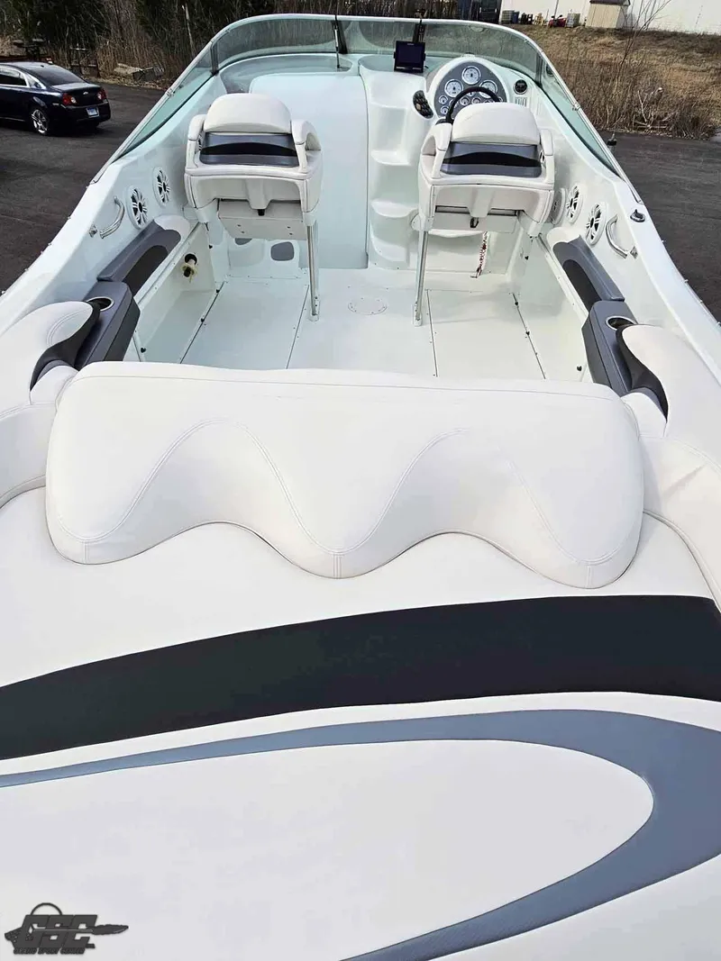 Slide: The Image of 2003 Baja .38 Special boat interior with white seating and dual helm chairs. - 39