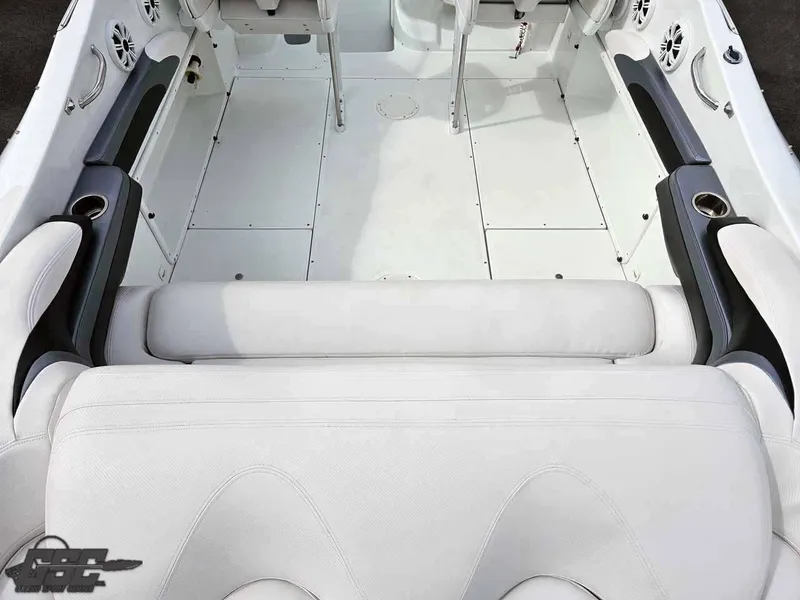Slide: The Image of Interior of a 2003 Baja .38 Special boat with white seating and cup holders. - 46