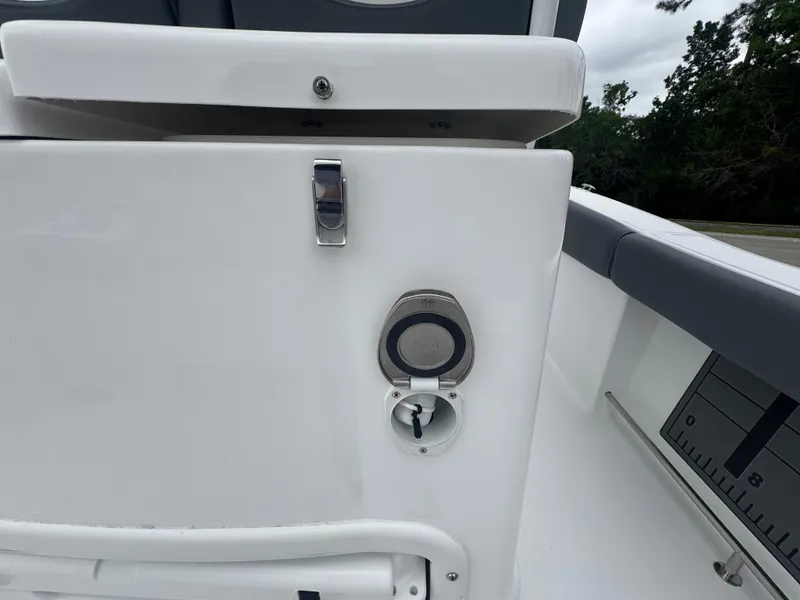 Slide: The Image of 2025 NauticStar 292 Legacy boat detail with sleek white finish and modern fittings. - 13