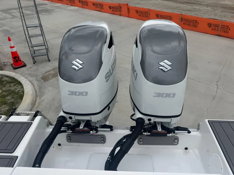 Slide: The Image of Twin Suzuki 300 outboard engines on a 2025 NauticStar 292 Legacy boat. - 24