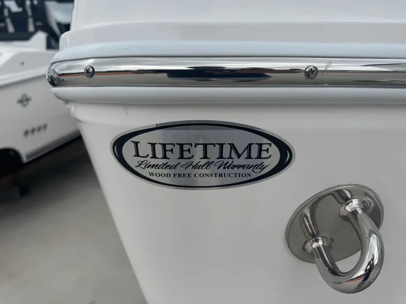 Slide: The Image of 2025 NauticStar 292 Legacy boat with lifetime warranty badge, wood-free construction. - 26