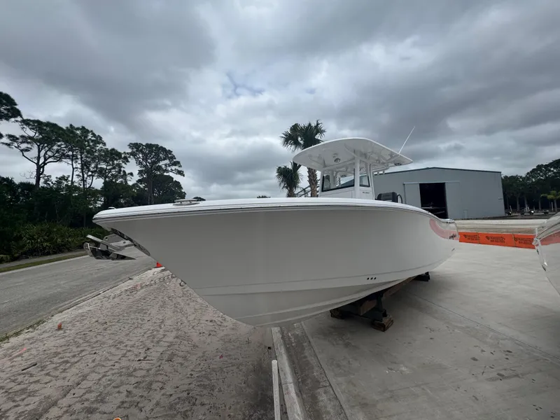 Slide: The Image of 2025 NauticStar 292 Legacy boat docked, showcasing sleek design and modern features. - 3