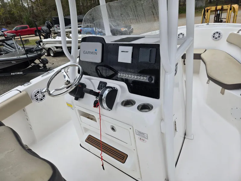 Slide: The Image of 2020 Tidewater 220 LXF boat console with Garmin electronics and steering wheel. - 12