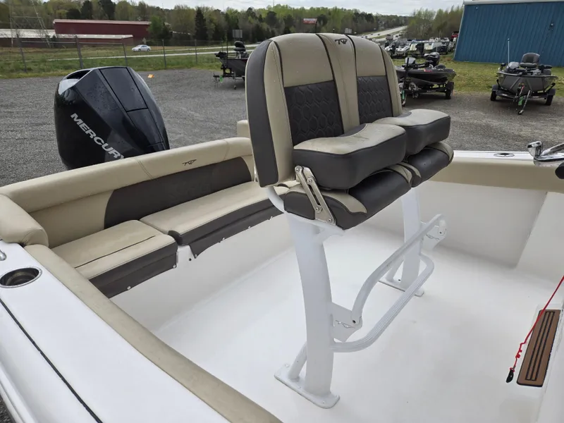 Slide: The Image of 2020 Tidewater 220 LXF boat interior with seating and Mercury engine. - 13