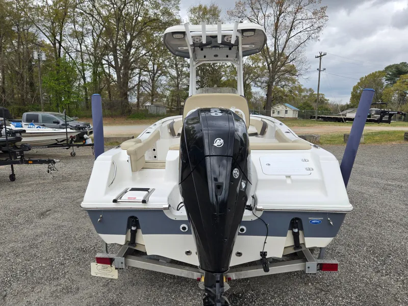 Slide: The Image of 2020 Tidewater 220 LXF boat with outboard motor, parked on a trailer in a lot. - 5