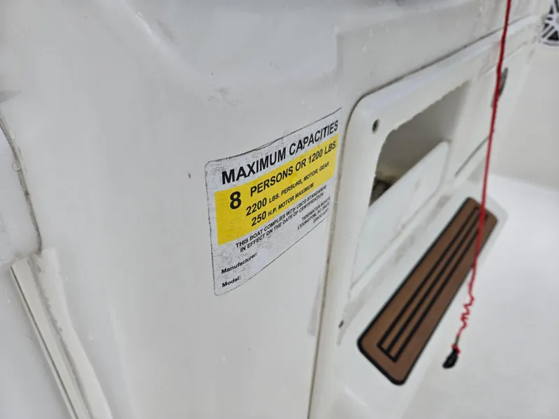 Slide: The Image of 2020 Tidewater 220 LXF boat capacity label, maximum 8 persons or 1200 lbs. - 8