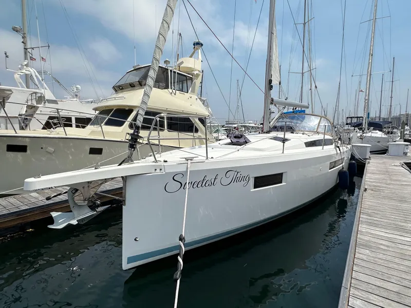 Slide: The Image of 2020 Jeanneau Sun Odyssey 410 sailboat docked at marina, named "Sweetest Thing". - 15