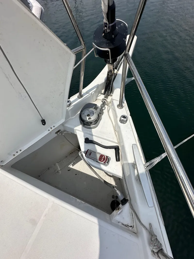 Slide: The Image of 2020 Jeanneau Sun Odyssey 410 sailboat deck with anchor and winch system. - 29