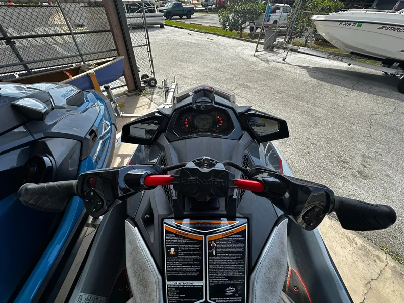 Slide: The Image of 2018 Sea-Doo RXP-X 300 jet ski dashboard view in a storage area. - 6
