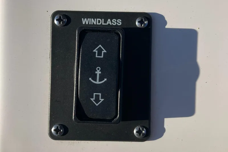 Slide: The Image of Windlass control switch on 2023 Sportsman Open 242 Center Console boat. - 14