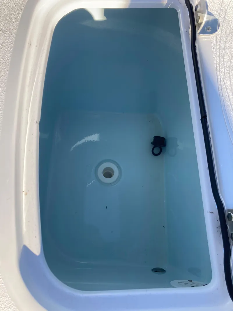 Slide: The Image of Livewell in 2023 Sportsman Open 242 Center Console boat, filled with water. - 19