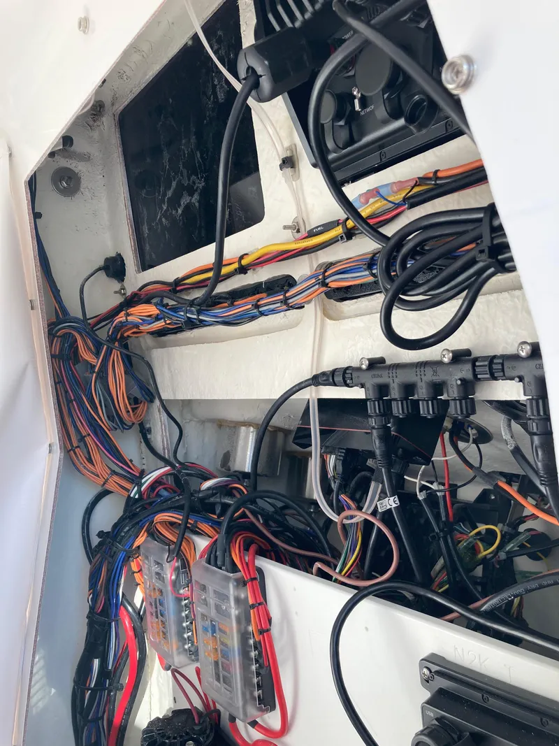 Slide: The Image of 2023 Sportsman Open 242 Center Console wiring and electronics detail. - 22