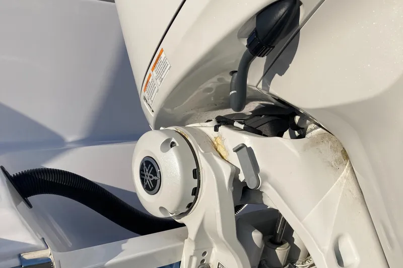 Slide: The Image of 2023 Sportsman Open 242 Center Console boat engine detail, featuring a Yamaha motor component. - 8